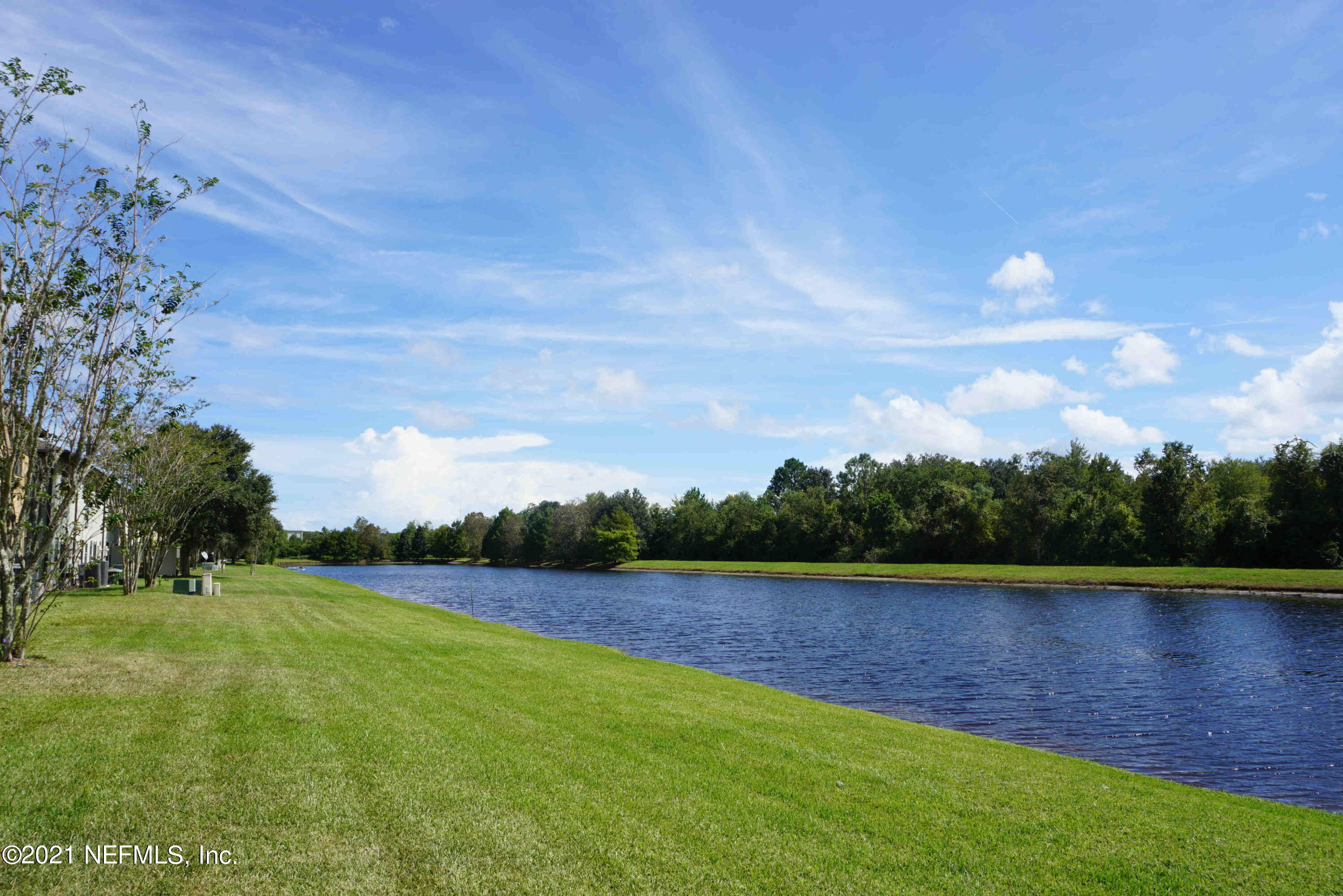 457 Cabernet Place St. Augustine, FL 32084 - Photo 17 of 19 a view of a lake with a big yard