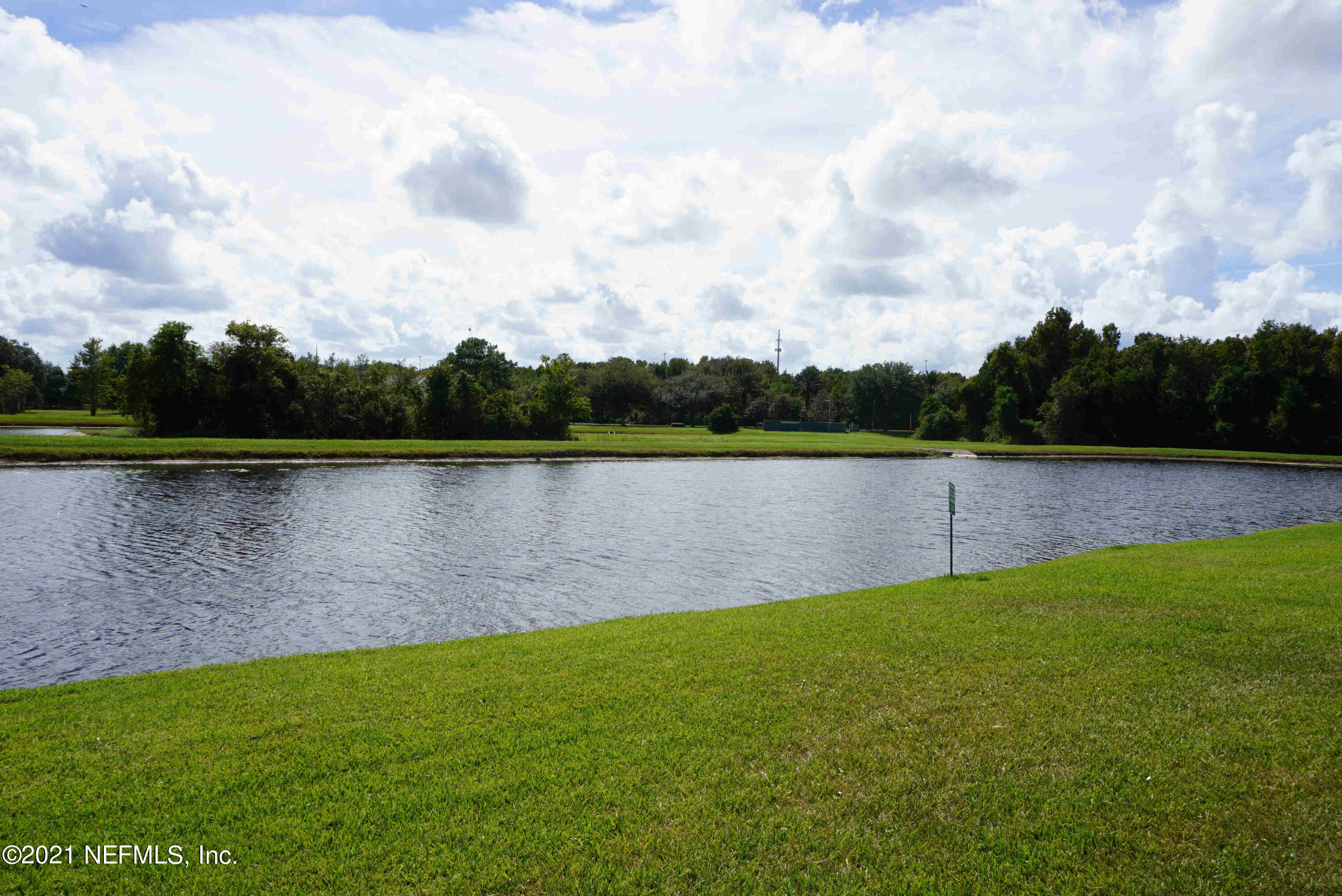 457 Cabernet Place St. Augustine, FL 32084 - Photo 18 of 19 a view of a lake with a big yard