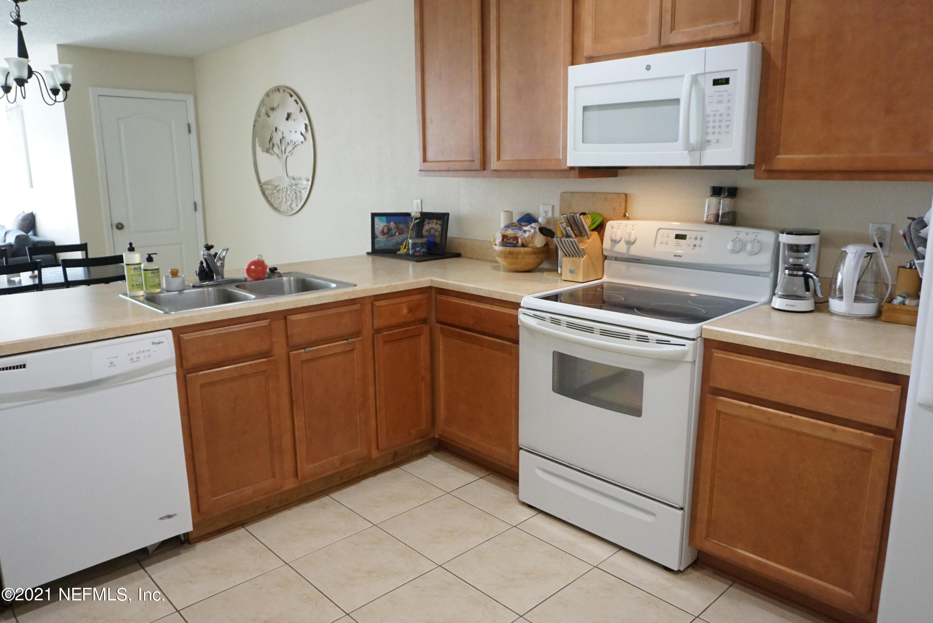 457 Cabernet Place St. Augustine, FL 32084 - Photo 7 of 19 a kitchen with cabinets appliances and a sink
