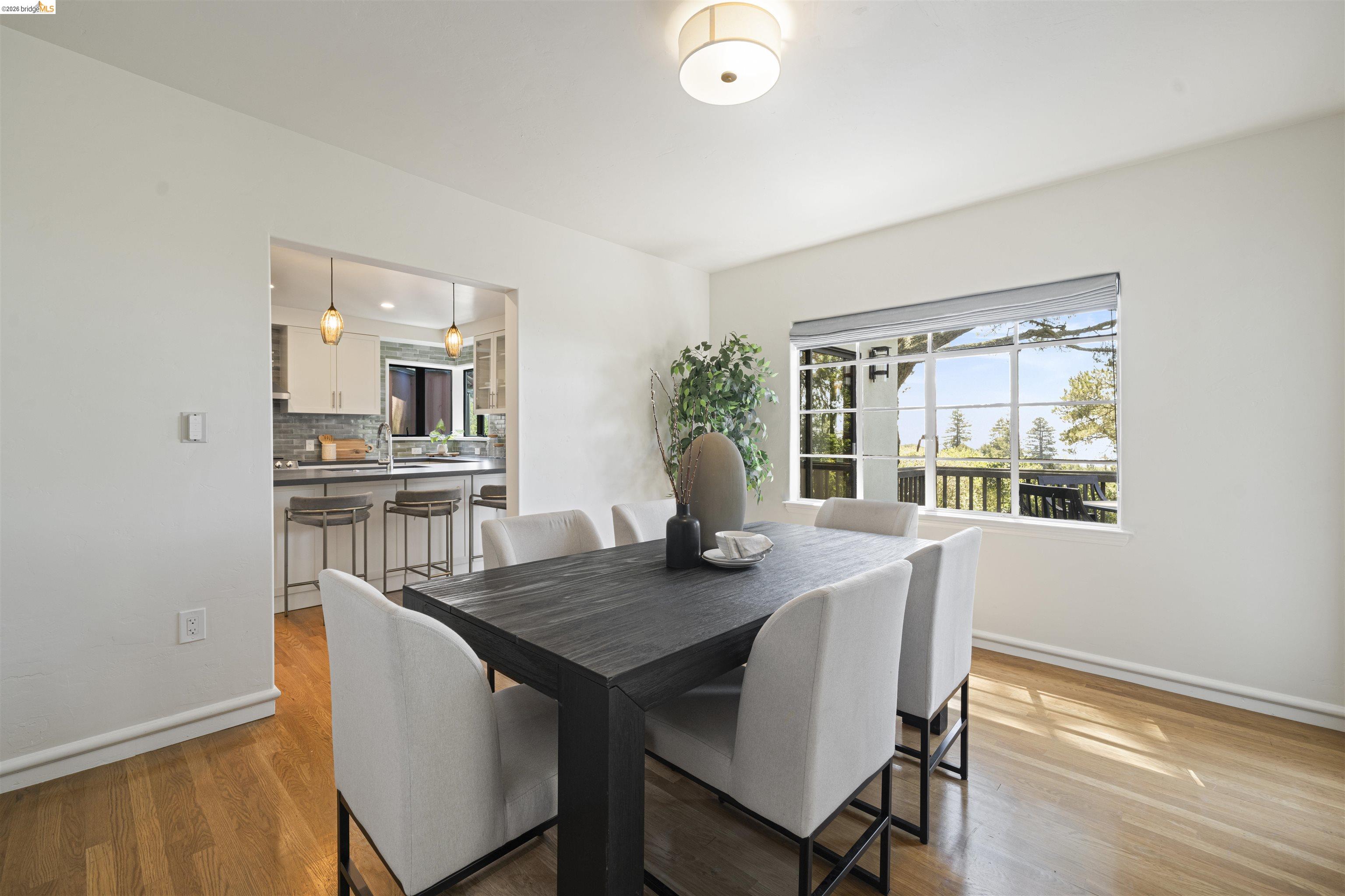 1170 Sterling Avenue Berkeley, CA 94708 - Photo 7 of 52 Dining space featuring light wood-style flooring and baseboards