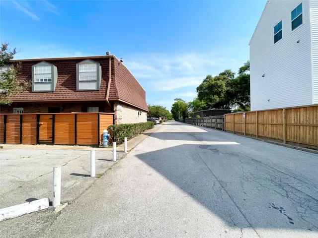 a view of a brick house with a street