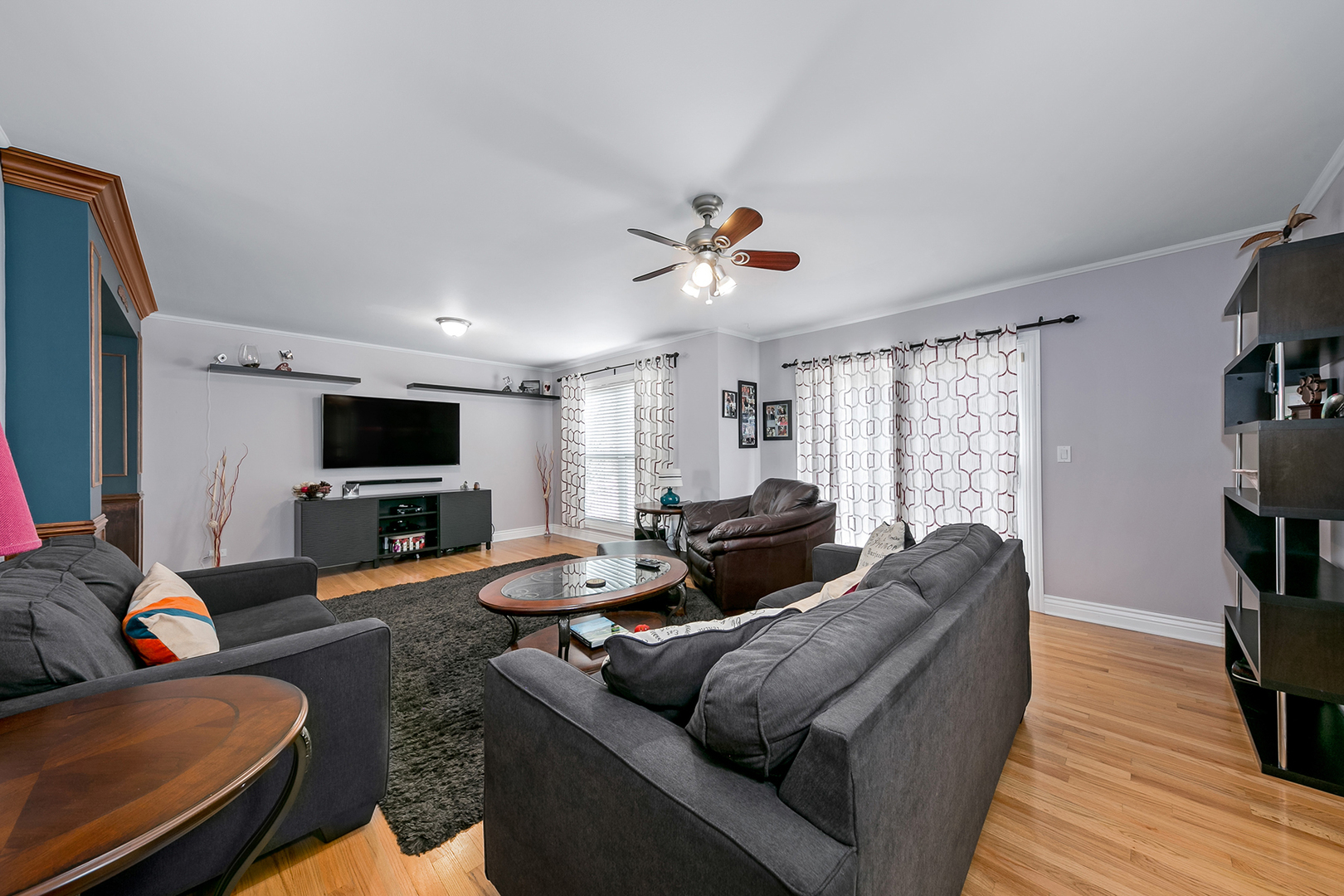 420 Butterfly Road Bolingbrook, IL 60490 - Photo 11 of 29 a living room with furniture a flat screen tv and a large window