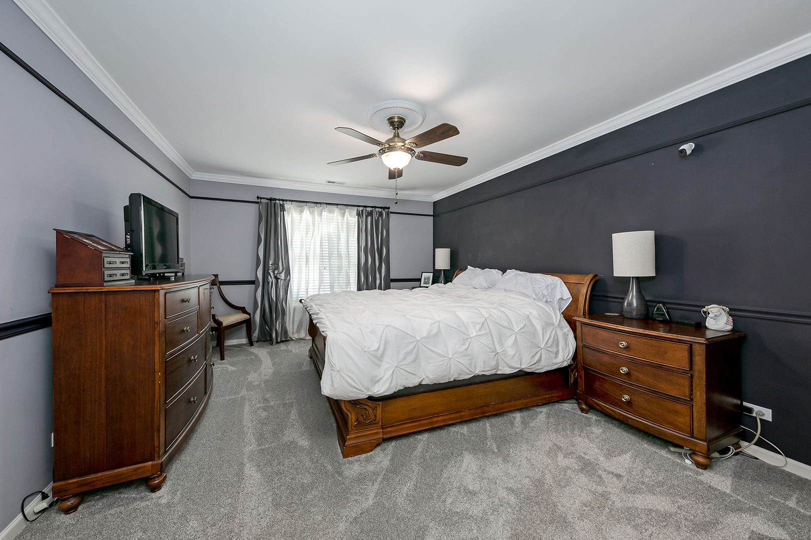 420 Butterfly Road Bolingbrook, IL 60490 - Photo 14 of 29 a spacious bedroom with a bed and a chandelier
