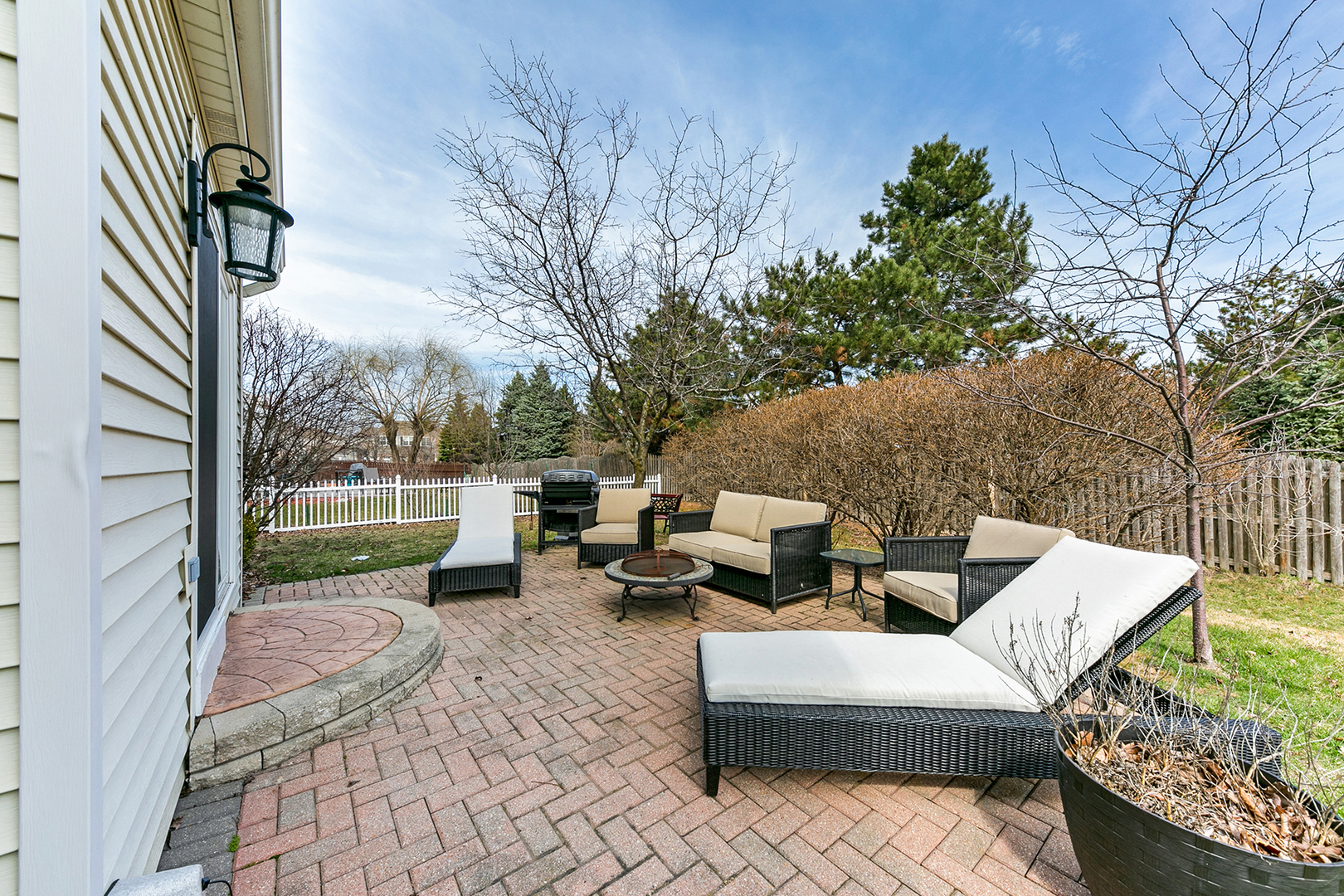 420 Butterfly Road Bolingbrook, IL 60490 - Photo 25 of 29 a backyard of a house with barbeque oven table and chairs