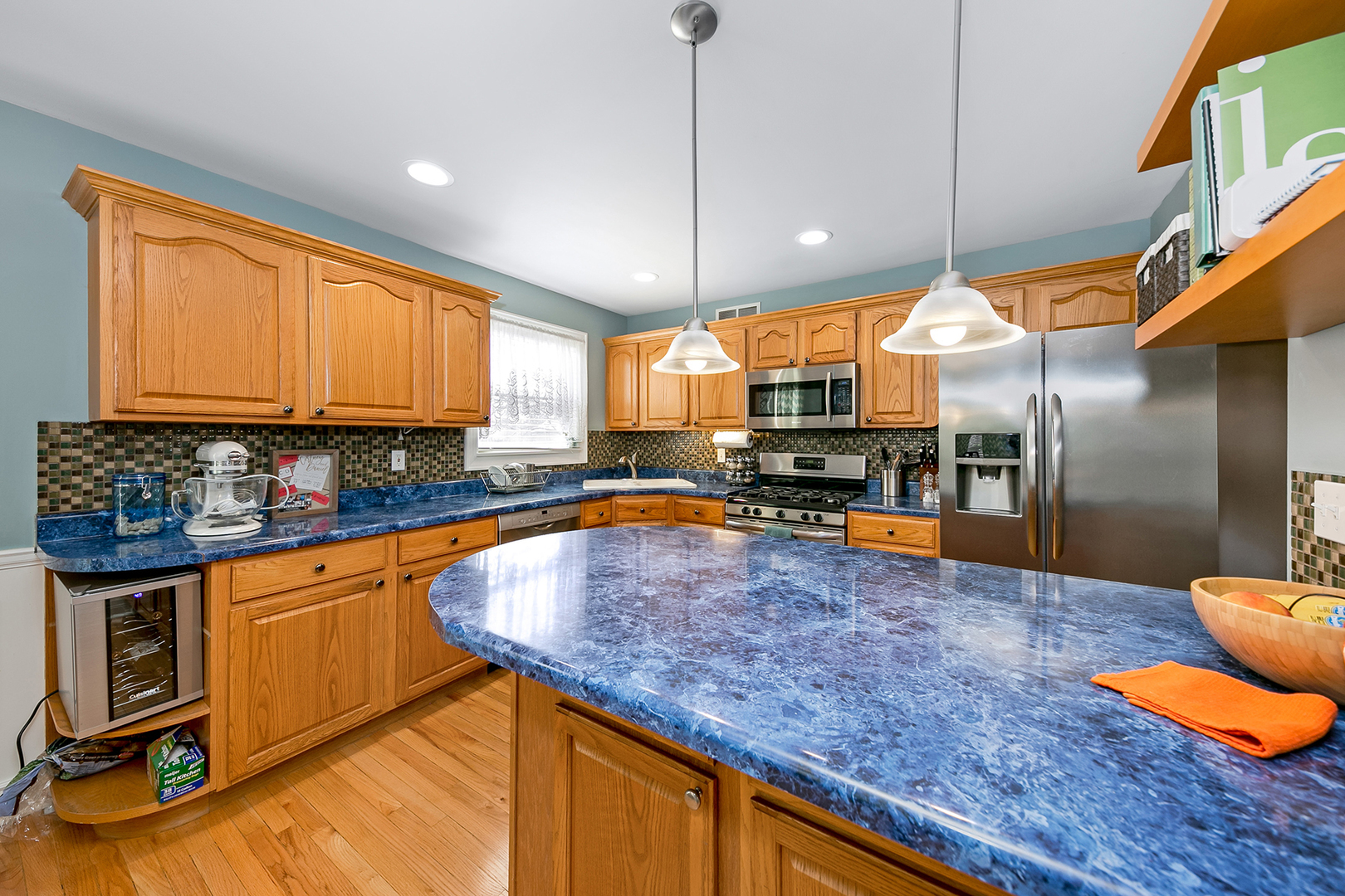 420 Butterfly Road Bolingbrook, IL 60490 - Photo 5 of 29 a kitchen with stainless steel appliances granite countertop a sink a stove and a wooden floors