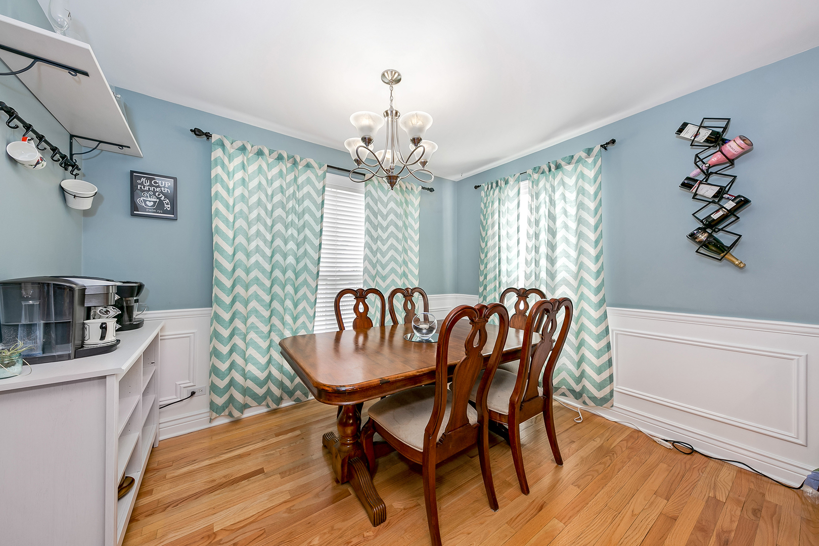 420 Butterfly Road Bolingbrook, IL 60490 - Photo 8 of 29 a dining room with furniture a chandelier and wooden floor