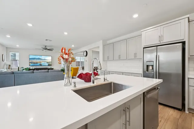 a patio with a table and chairs under an umbrella