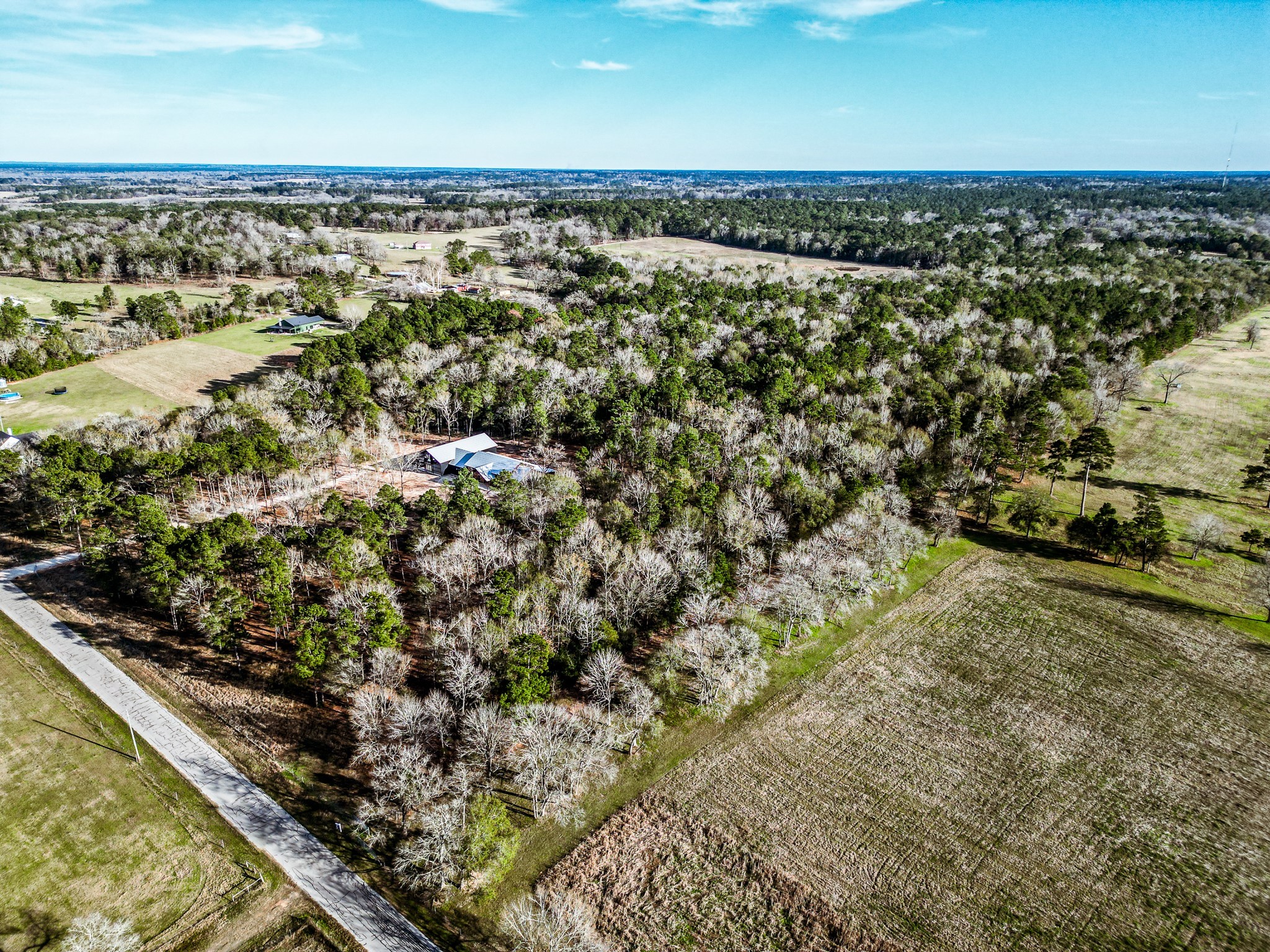 Tbd Jones Road New Waverly, TX 77358 - Photo 5 of 7 an aerial view of residential houses with outdoor space