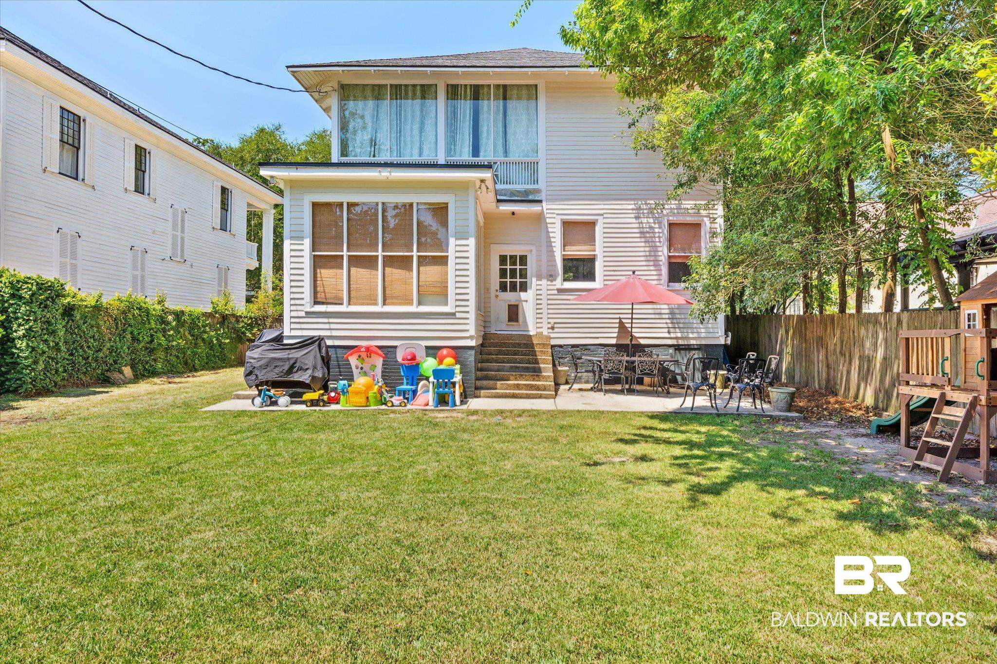 68 North Monterey Street Mobile, AL 36604 - Photo 26 of 30 Rear view of property with a lawn