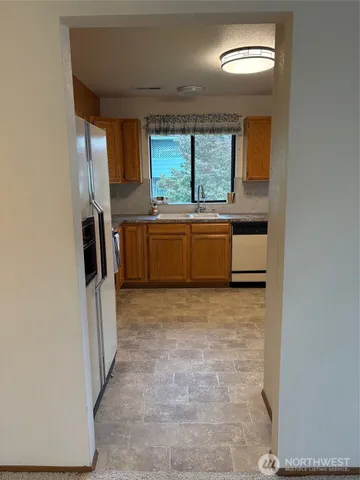 a kitchen with a stove and a microwave