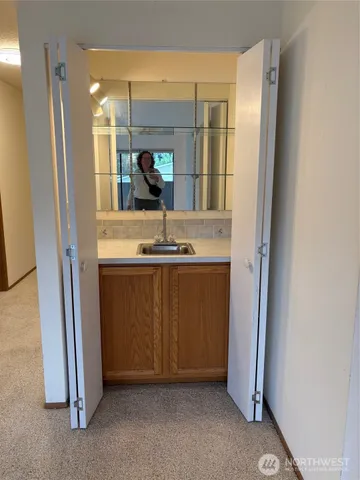 a room with cabinets and entryway