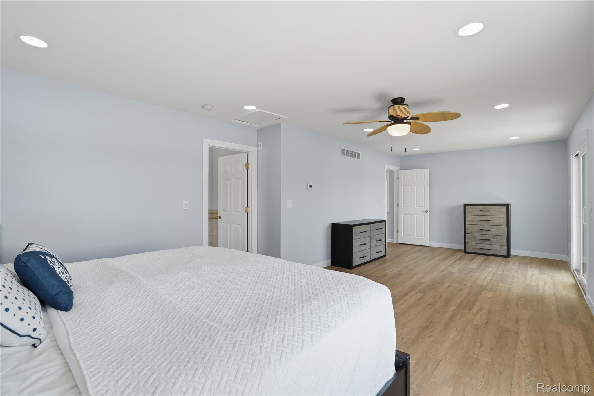 7217 Andersonville Road Clarkston, MI 48346 - Photo 25 of 65 Spacious room featuring wood-finish flooring, recessed lighting, and a ceiling fan
