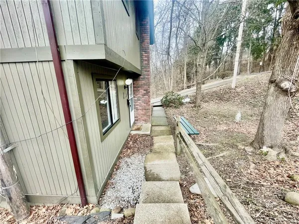 a view of outdoor space with wooden floor
