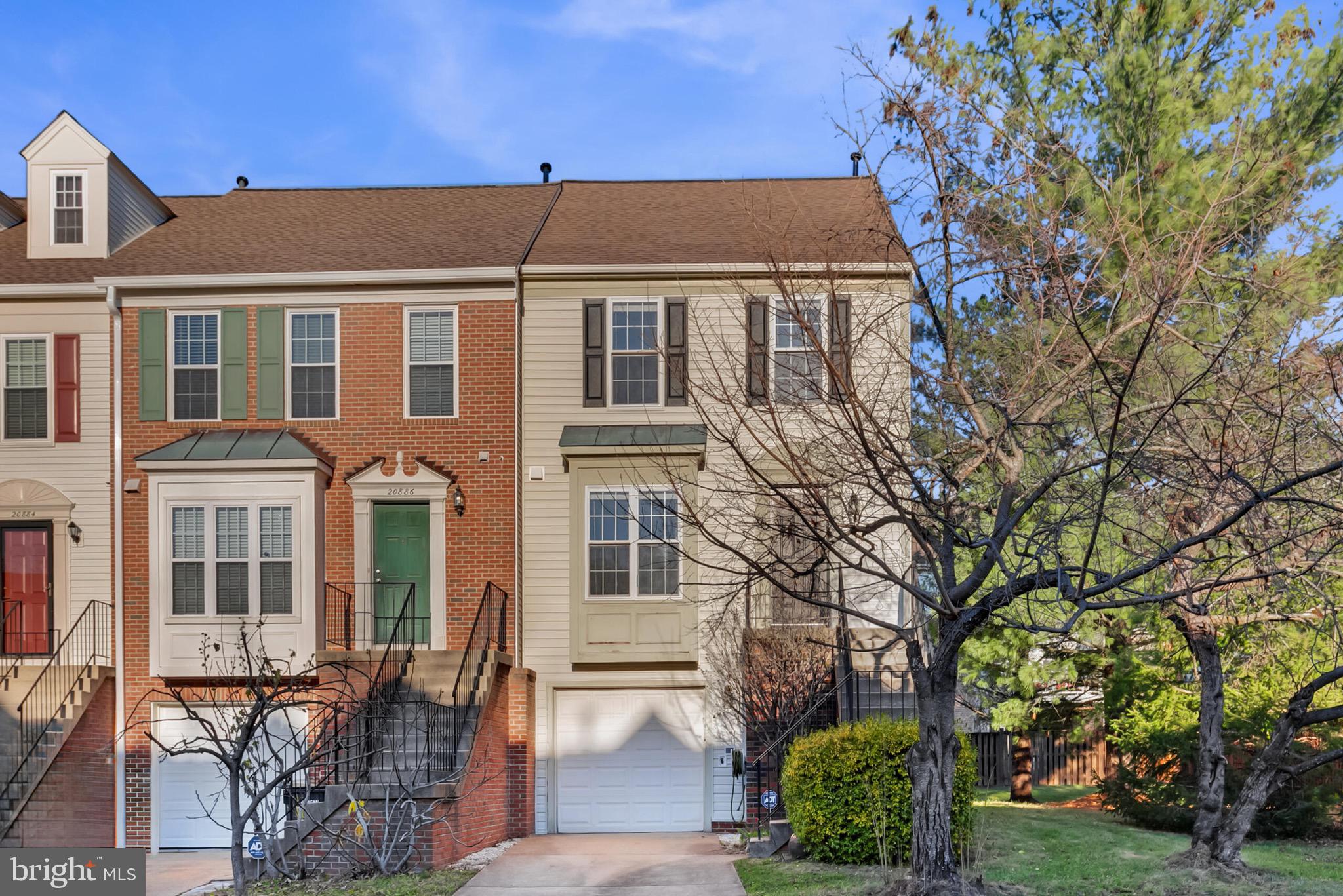 20888 Sandstone Square Sterling, VA 20165 - Photo 1 of 33 a front view of a house with garden