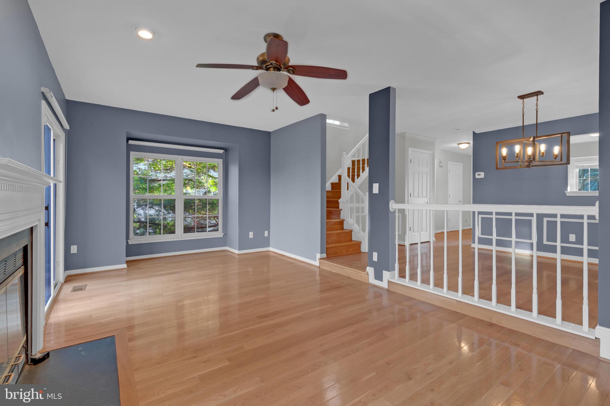20888 Sandstone Square Sterling, VA 20165 - Photo 12 of 33 an empty room with ceiling fan and windows