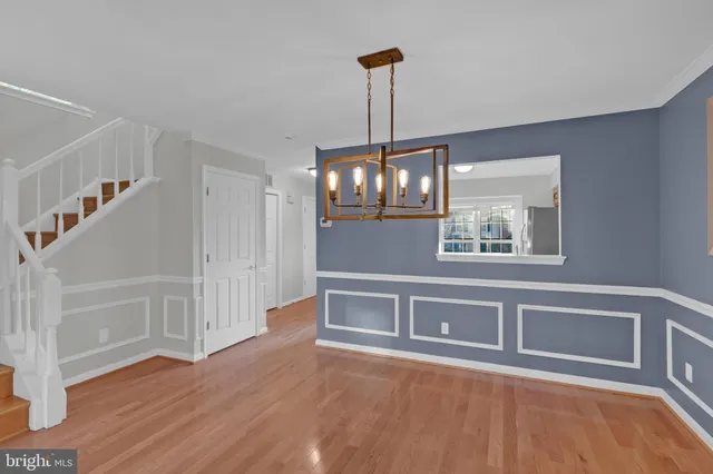 a view of an entryway with wooden floor