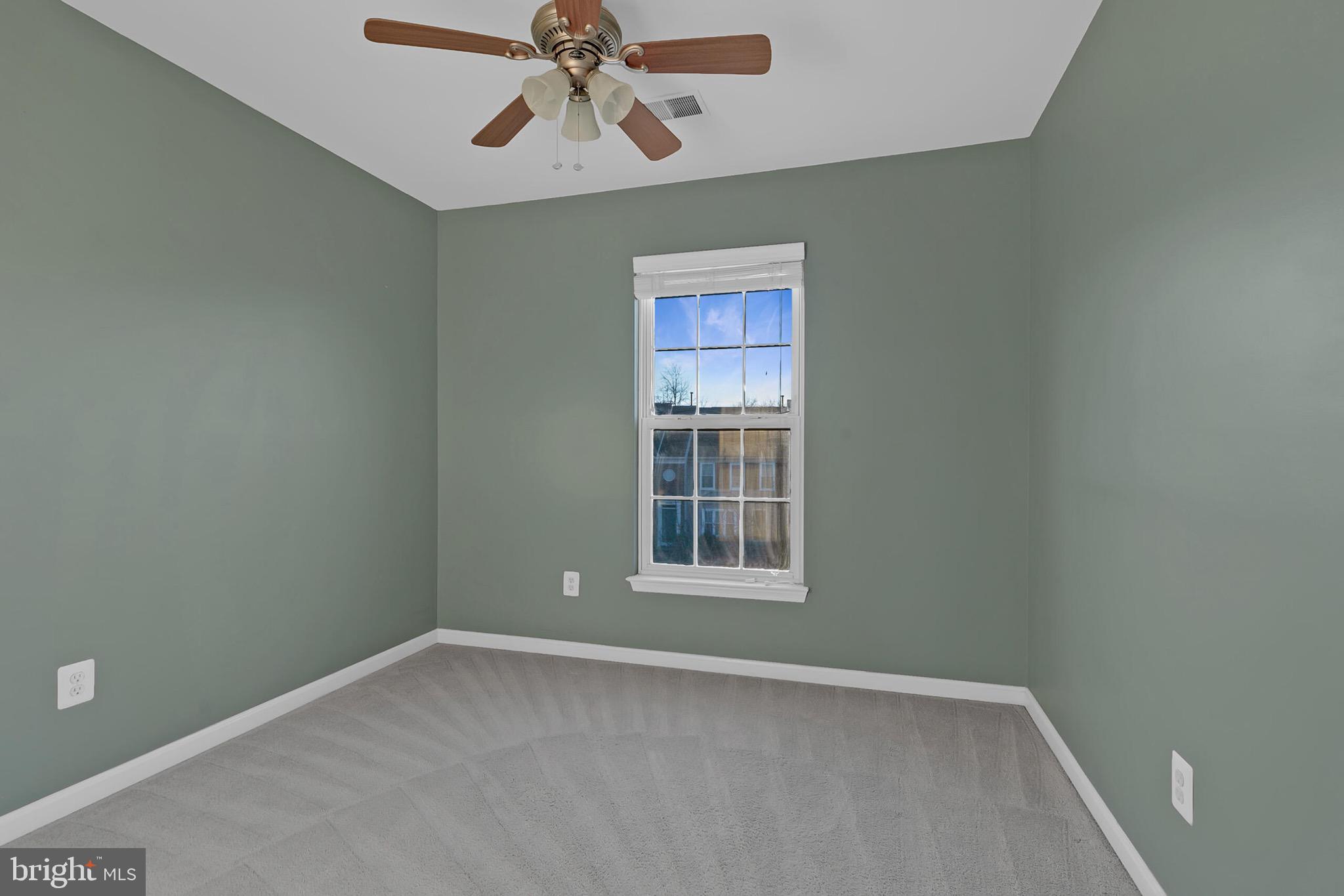 20888 Sandstone Square Sterling, VA 20165 - Photo 20 of 33 an empty room with windows and fan
