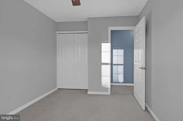 a view of an empty room and a window