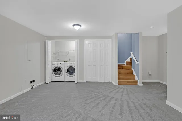 a view of entryway with wooden stairs