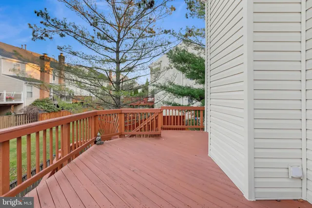 a view of a deck with mountain view and wooden floor