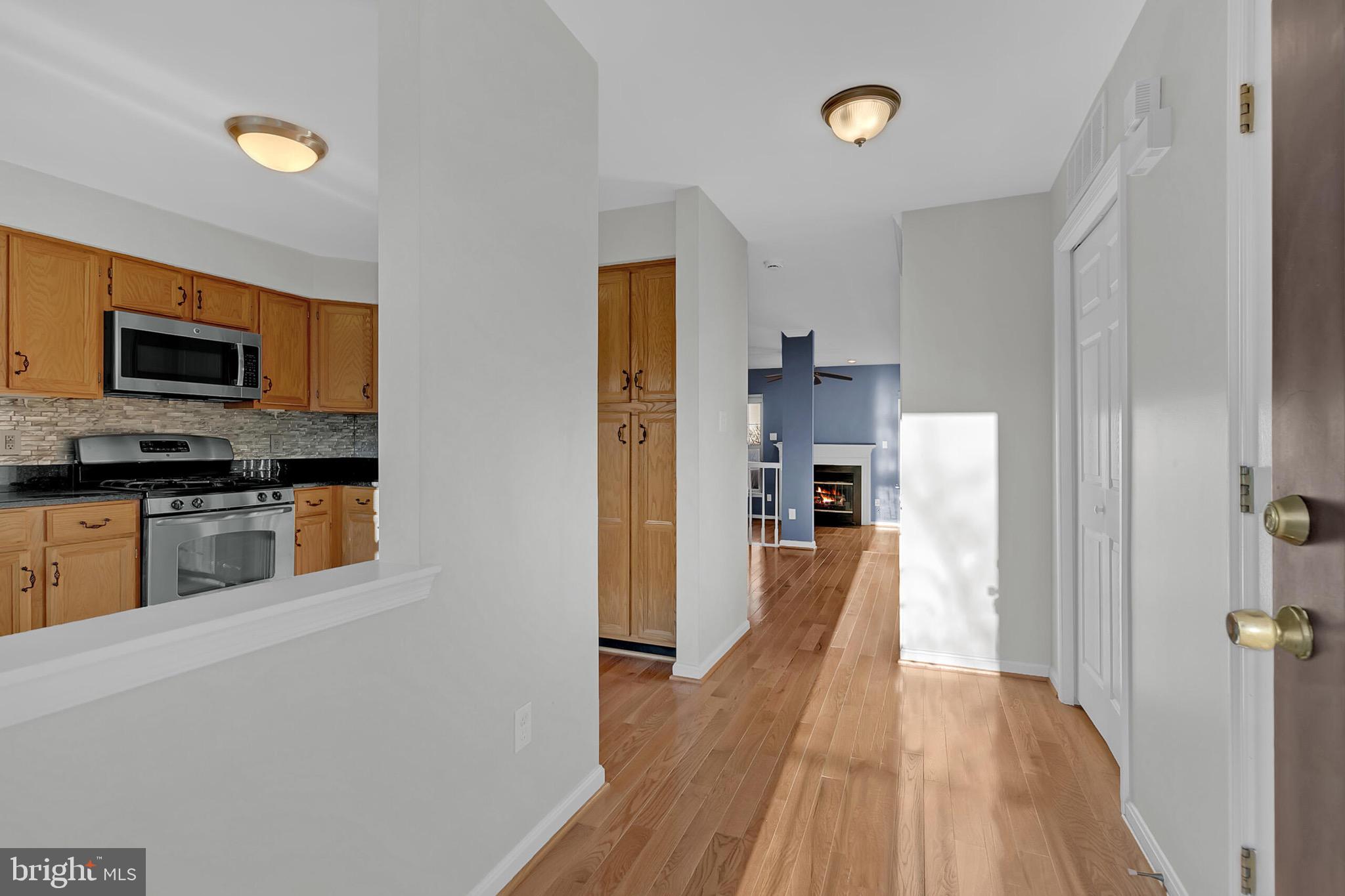 20888 Sandstone Square Sterling, VA 20165 - Photo 3 of 33 a view of a kitchen from the hallway