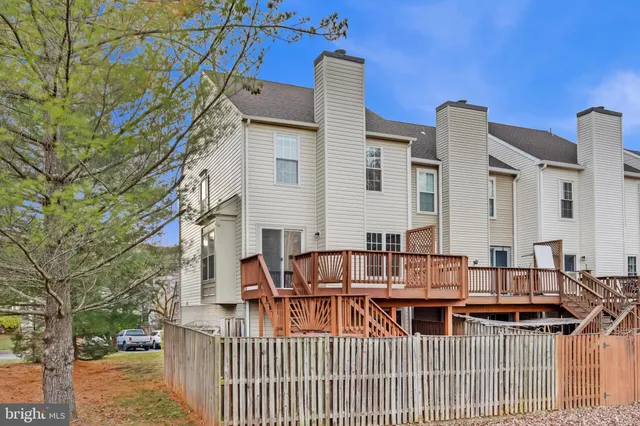 a front view of a house with a deck