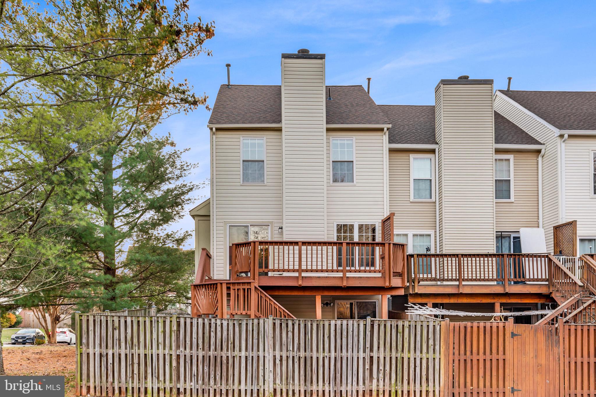 20888 Sandstone Square Sterling, VA 20165 - Photo 33 of 33 a front view of a house with a deck
