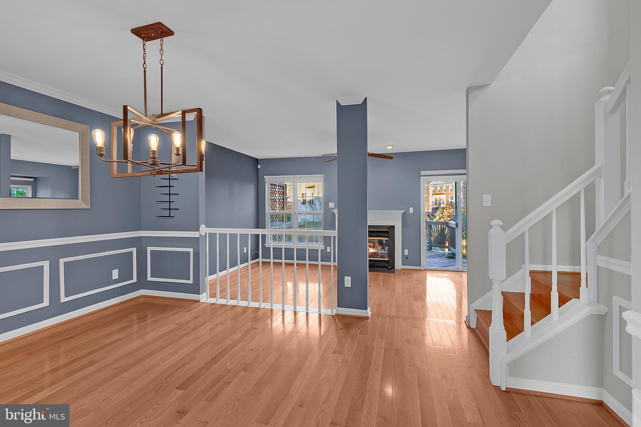 20888 Sandstone Square Sterling, VA 20165 - Photo 8 of 33 a view of an empty room with window and wooden floor