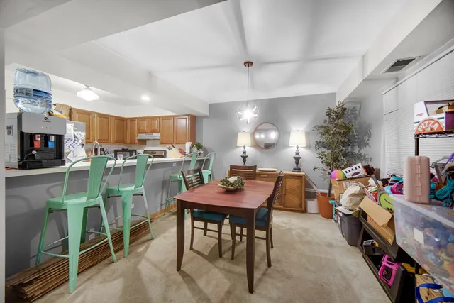 a view of a dining room with furniture and a livingroom