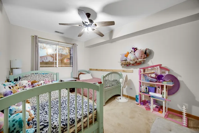 a bed room with a bed and a window