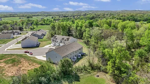 an aerial view of a house with a garden