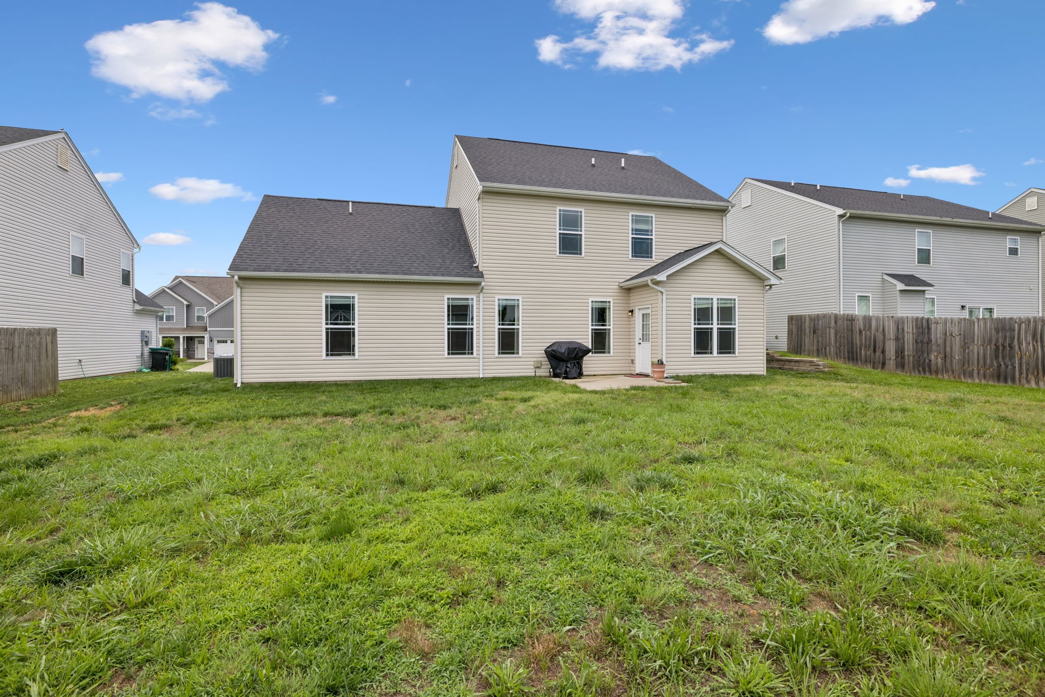 1002 Garrison Way Spring Hill, TN 37174 - Photo 61 of 63 a front view of a house with a yard porch and outdoor seating