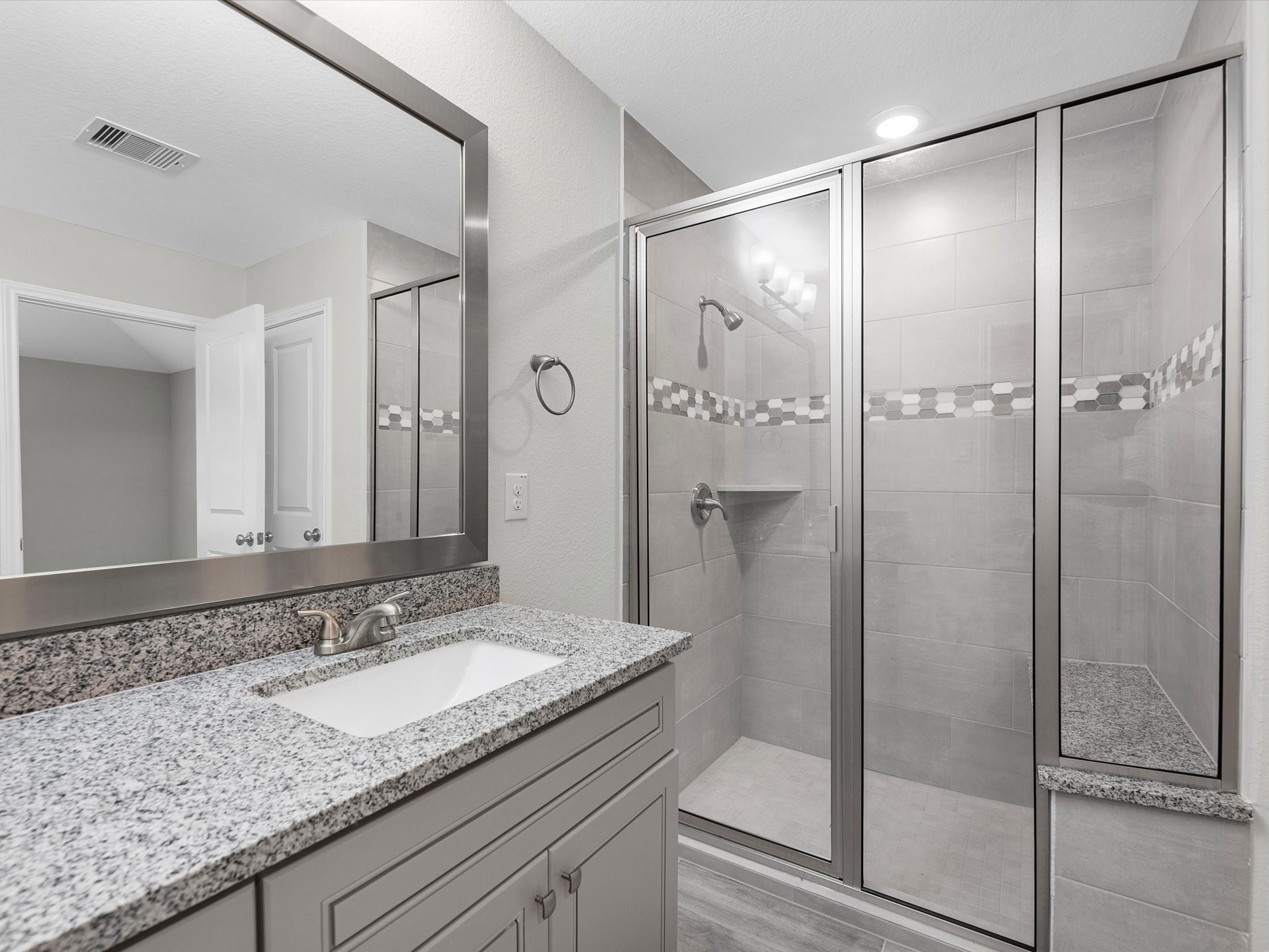 46 Fairway Drive Trinity, TX 75862 - Photo 14 of 26 a bathroom with a granite countertop sink shower and a mirror
