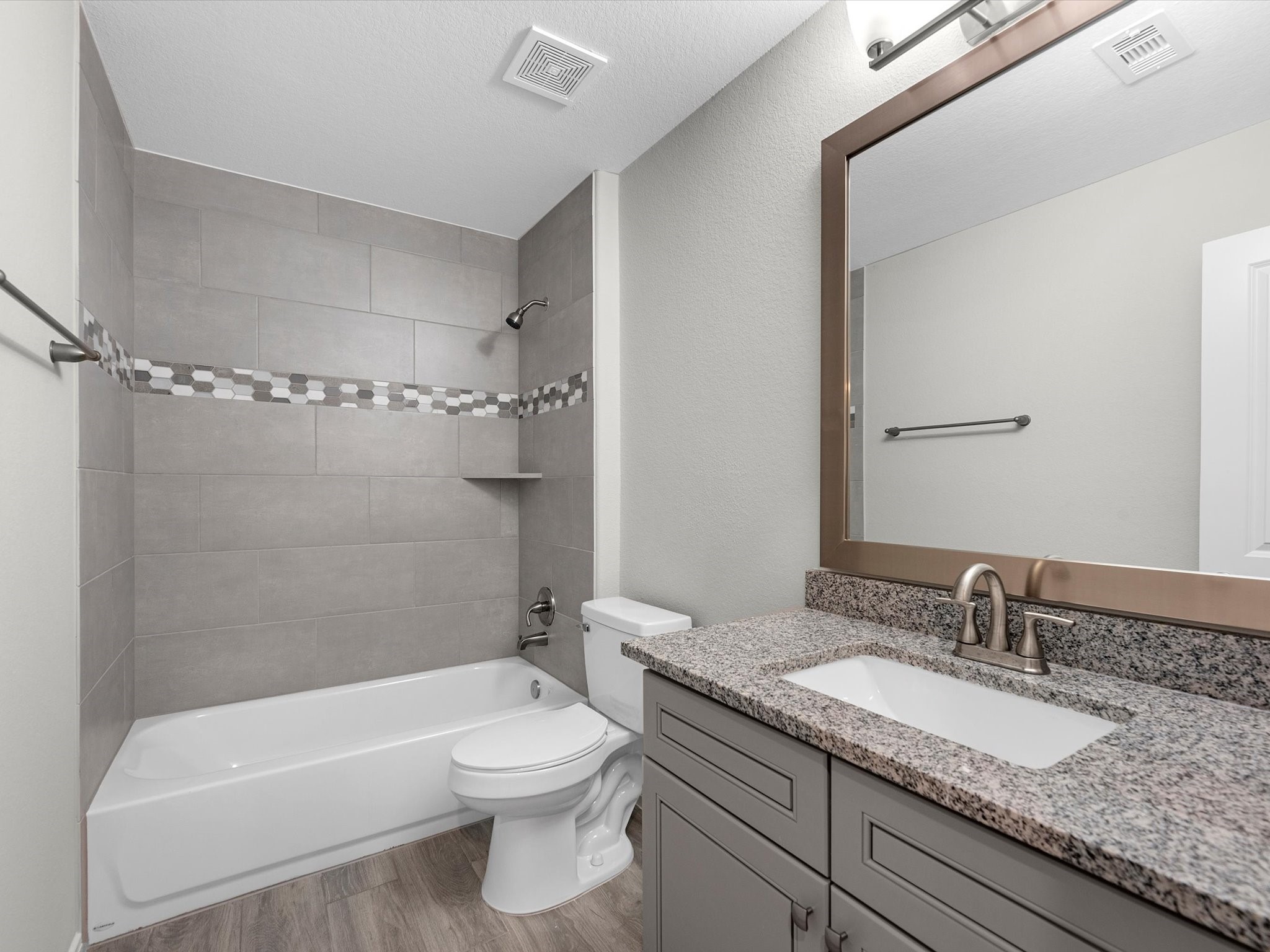 46 Fairway Drive Trinity, TX 75862 - Photo 17 of 26 a bathroom with a granite countertop sink toilet and shower