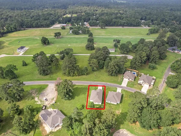 an aerial view of a houses with outdoor space and a lake view