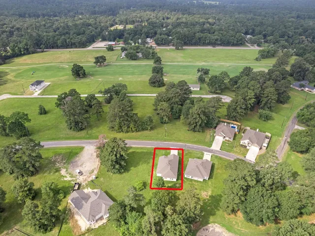 an aerial view of a houses with outdoor space and a lake view