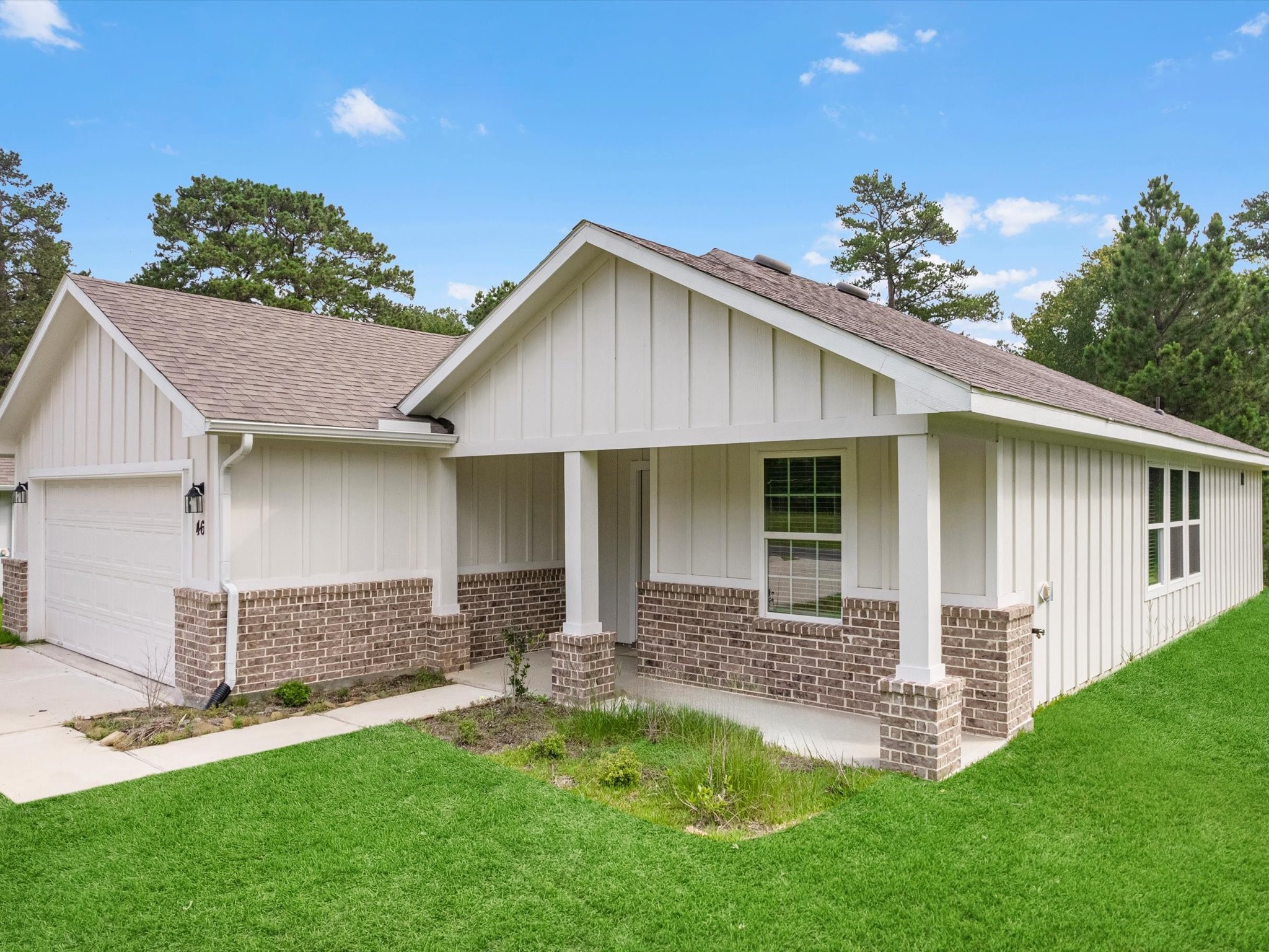 46 Fairway Drive Trinity, TX 75862 - Photo 3 of 26 a front view of a house with a garden and yard
