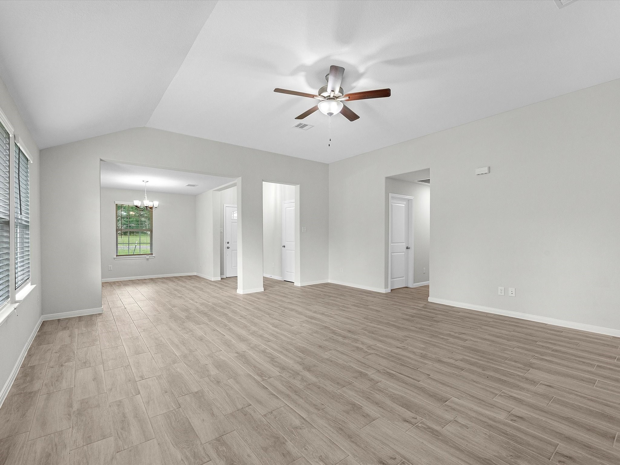 46 Fairway Drive Trinity, TX 75862 - Photo 5 of 26 a view of an empty room with wooden floor and a window