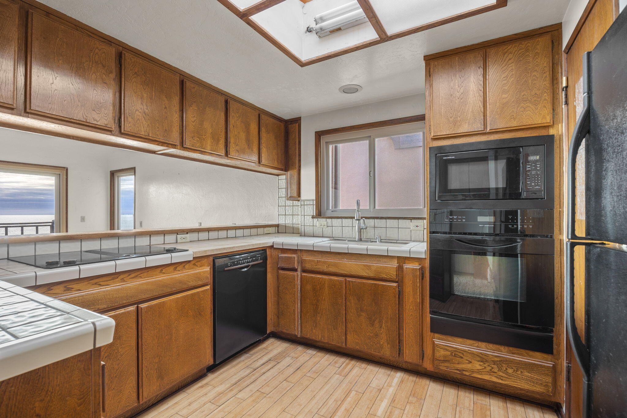 6726 Breakers Way Ventura, CA 93001 - Photo 14 of 42 a kitchen with stainless steel appliances granite countertop a stove and a sink