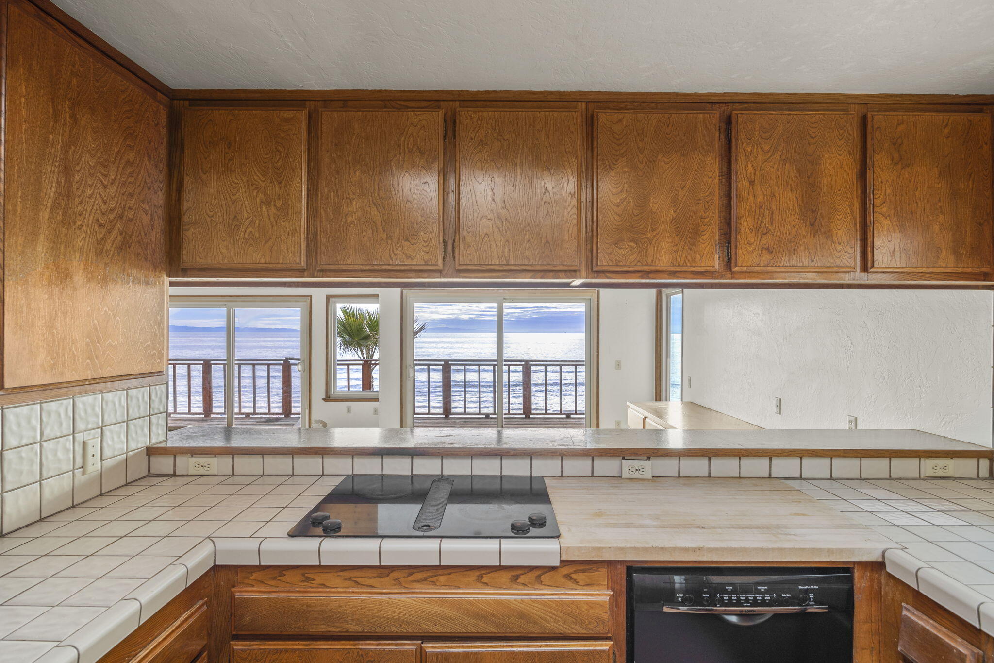 6726 Breakers Way Ventura, CA 93001 - Photo 15 of 42 a kitchen with granite countertop cabinets and window