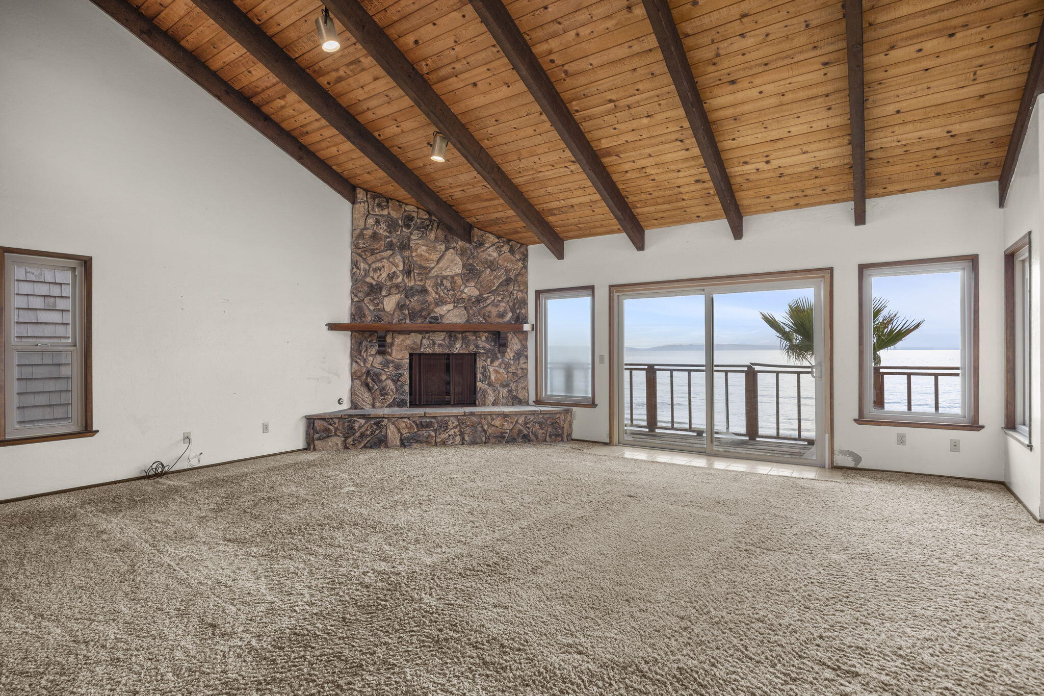 6726 Breakers Way Ventura, CA 93001 - Photo 20 of 42 a view of an empty room with a fireplace and a window