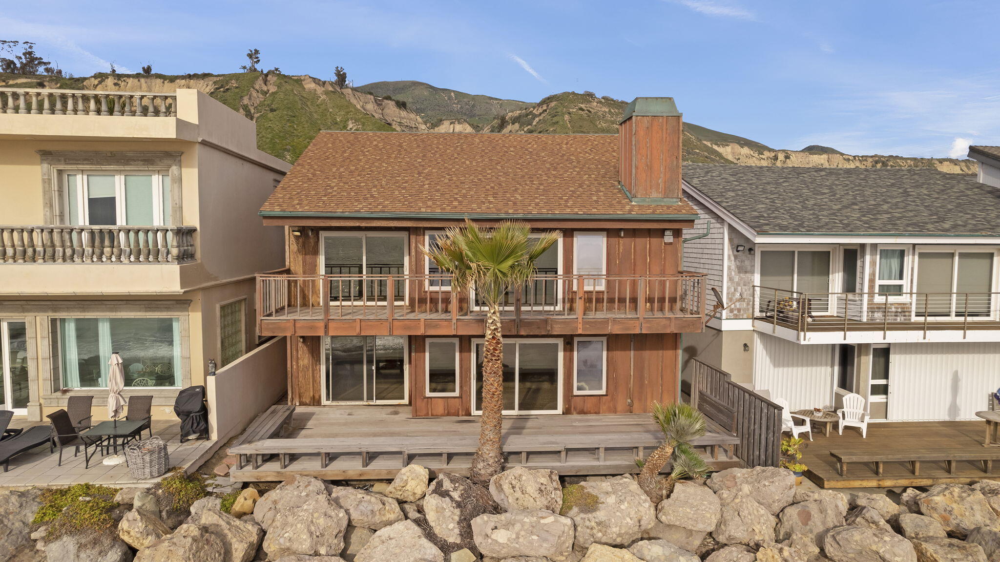 6726 Breakers Way Ventura, CA 93001 - Photo 2 of 42 a front view of a house with a yard