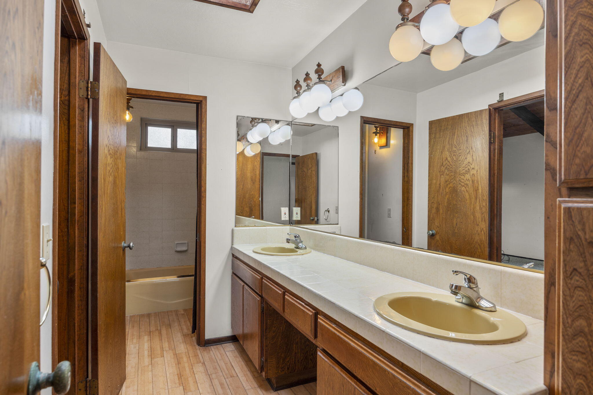 6726 Breakers Way Ventura, CA 93001 - Photo 28 of 42 a bathroom with a sink a large mirror and a shower