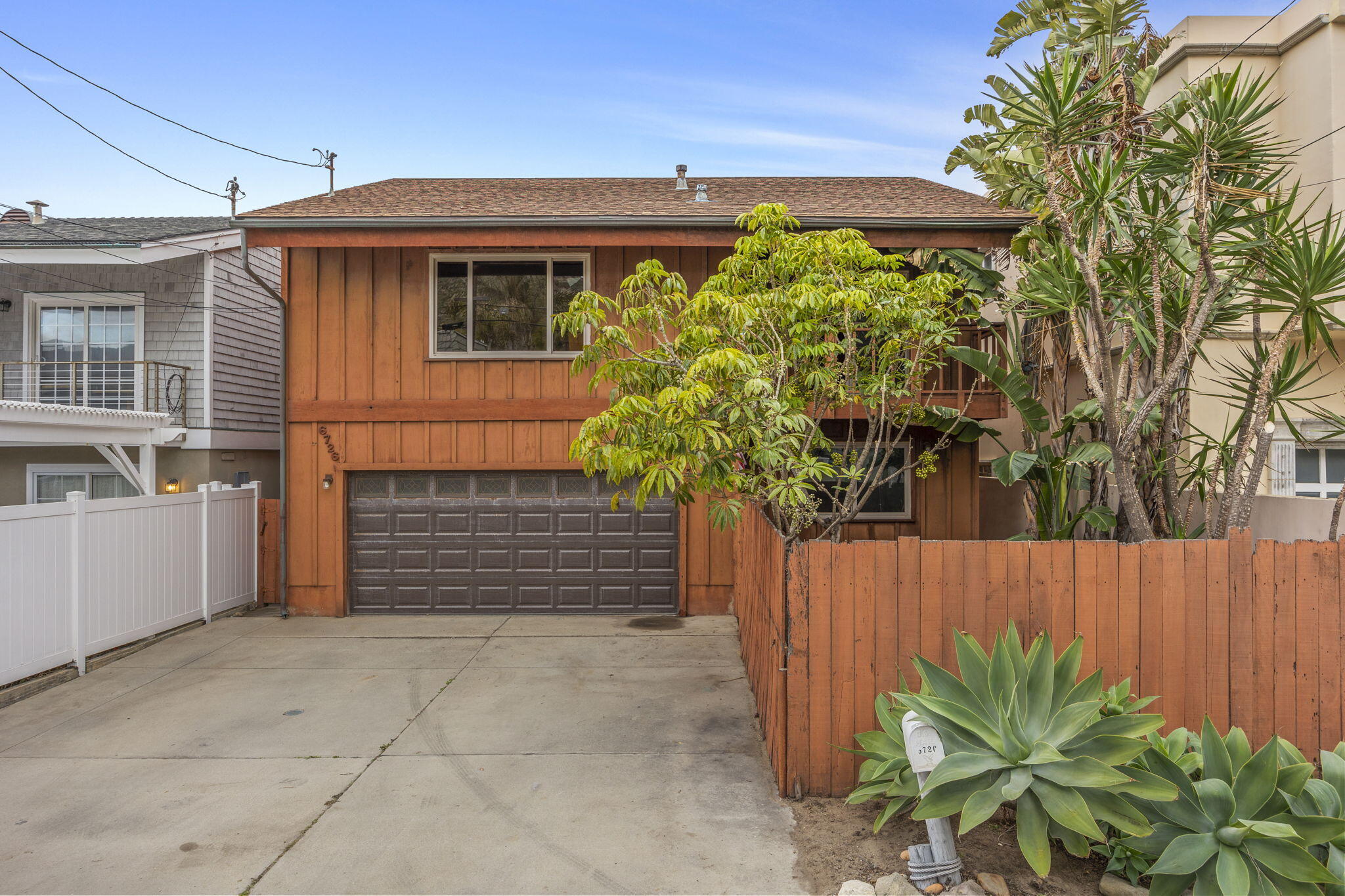 6726 Breakers Way Ventura, CA 93001 - Photo 6 of 42 a front view of a house with a yard