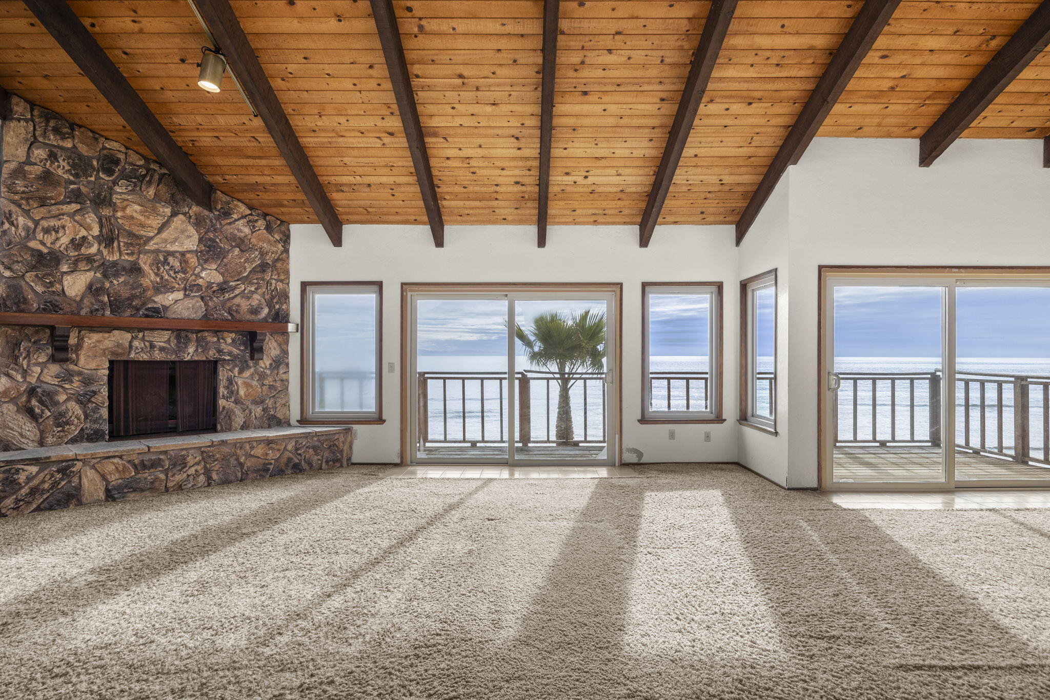 6726 Breakers Way Ventura, CA 93001 - Photo 7 of 42 a view of an empty room with wooden floor and a fireplace