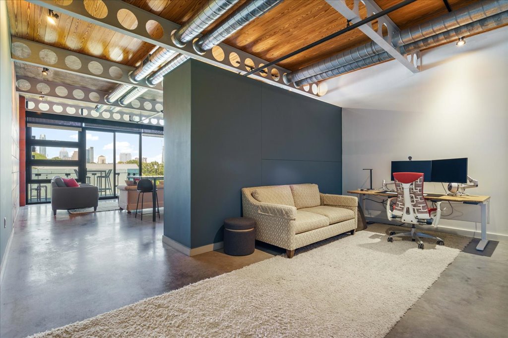 1401 Eva Street, Unit 302 Austin, TX 78704 - Photo 7 of 15 Office space featuring finished concrete flooring and a high ceiling