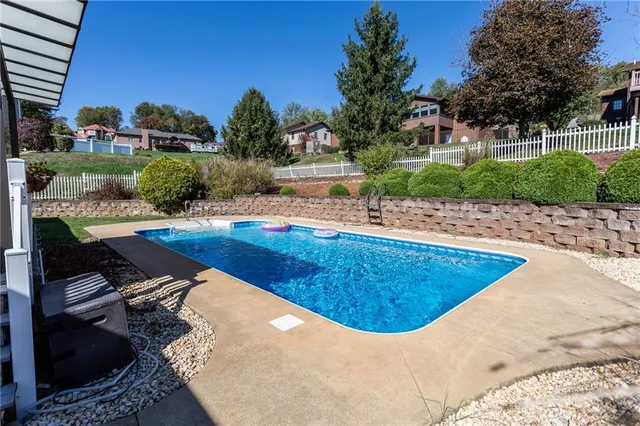 a view of a backyard with sitting area