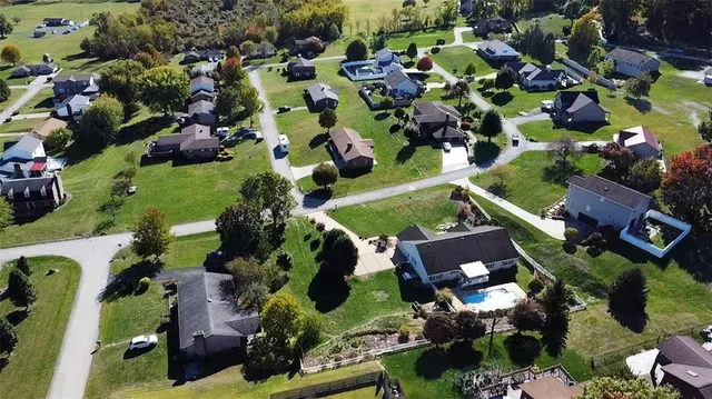 an aerial view of a town with couple of houses