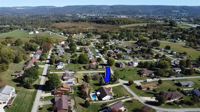 an aerial view of houses with yard