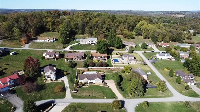 a kitchen with stainless steel appliances granite countertop a sink refrigerator and cabinets